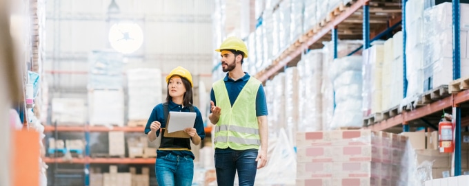 Workers checking stock in a warehouse